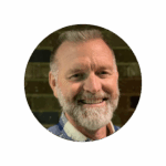 Portrait of Troy Waller, VP Healthcare at ID Integration, advising hospitals on equipment tracking and OR/SPD readiness.